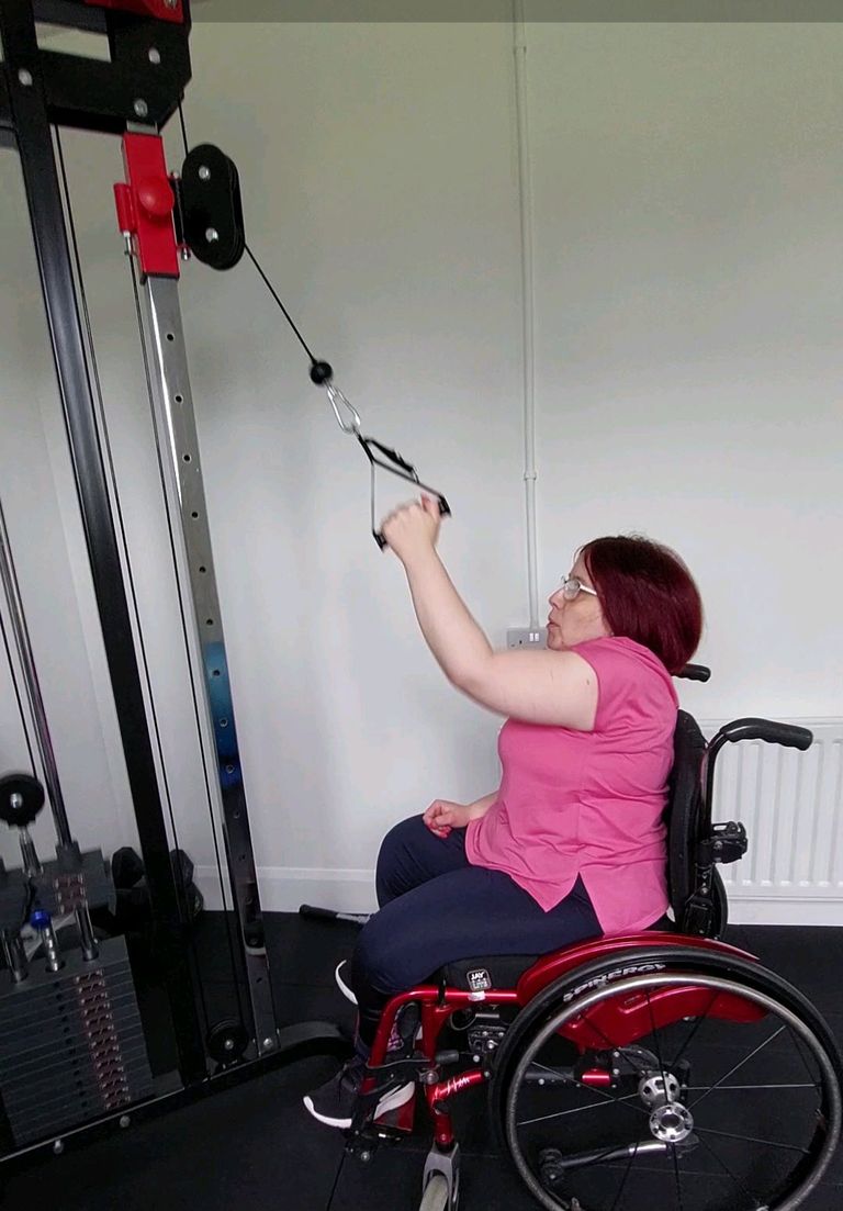 Wheelchair user performing an exercise